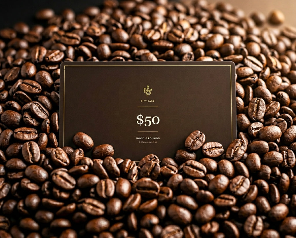 Good Grounds Gift Card nestled deeply in freshly roasted whole bean coffee